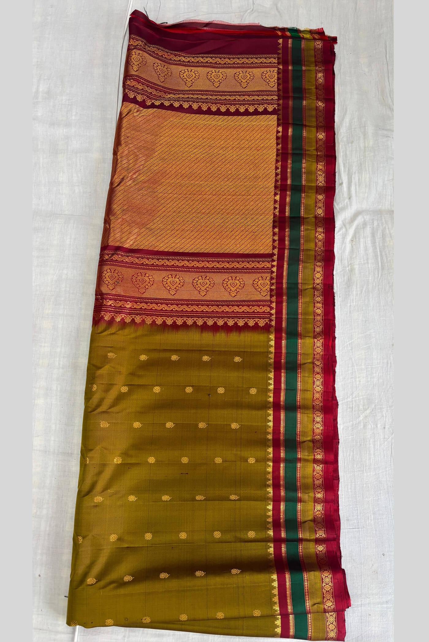 Mehendi green buta all over the saree red border Gadwal pure silk saree