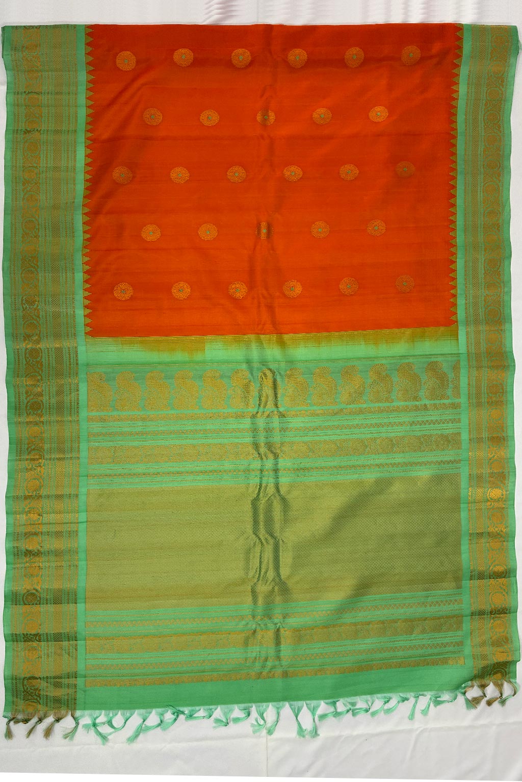 gadwal Peach orange butas with pista green small border handloom silk saree