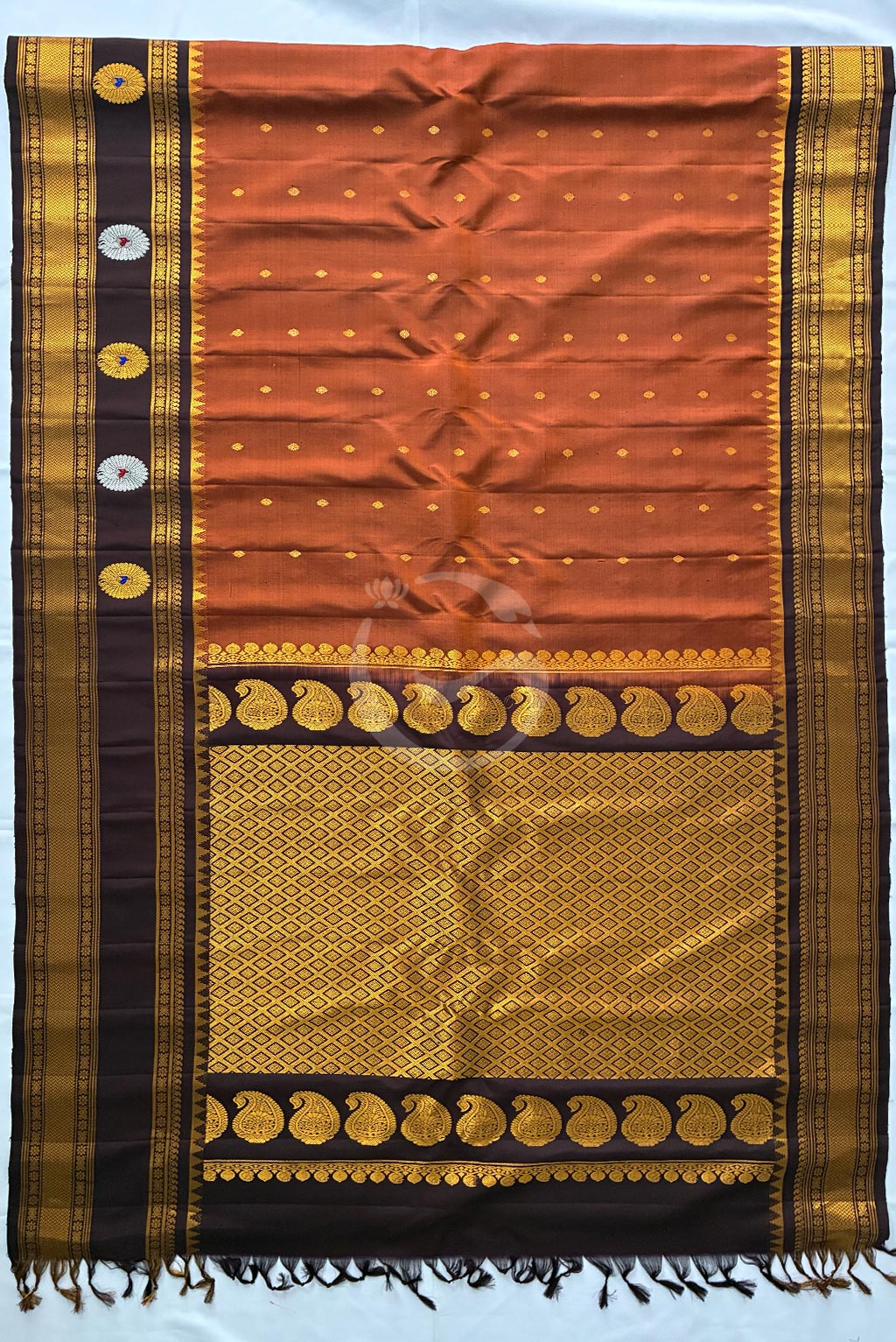 Gadwal Rust orange butas self gap buta border handloom silk saree