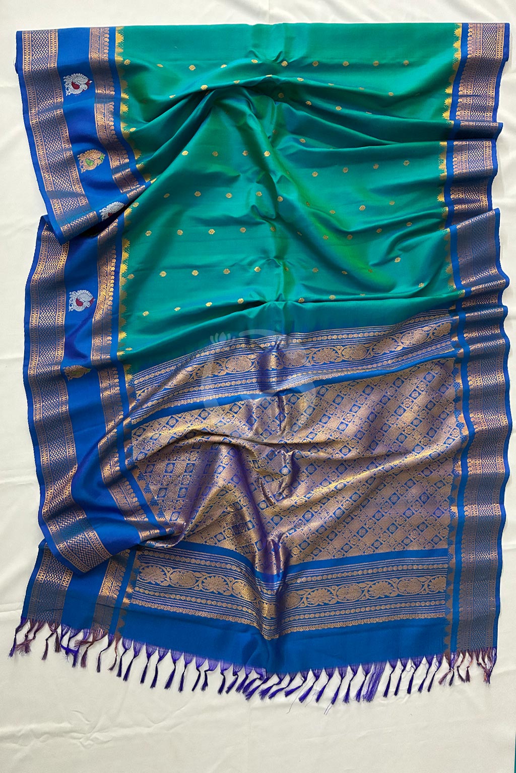 Gadwal buzz green buttas with self green butta gap border handloom silk saree