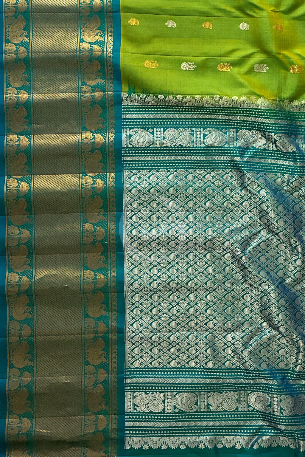Gadwal parrot green buttas self aqua blue gap butta border handloom silk saree