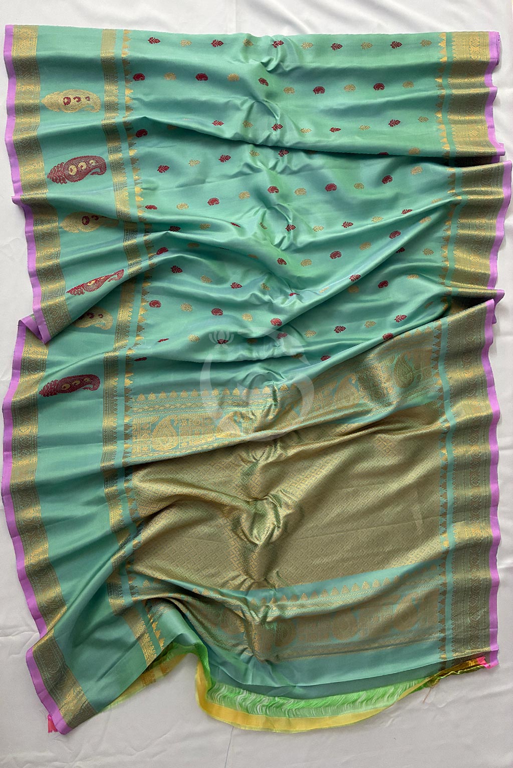 Gadwal peach green buttas self gap border butta handloom silk saree