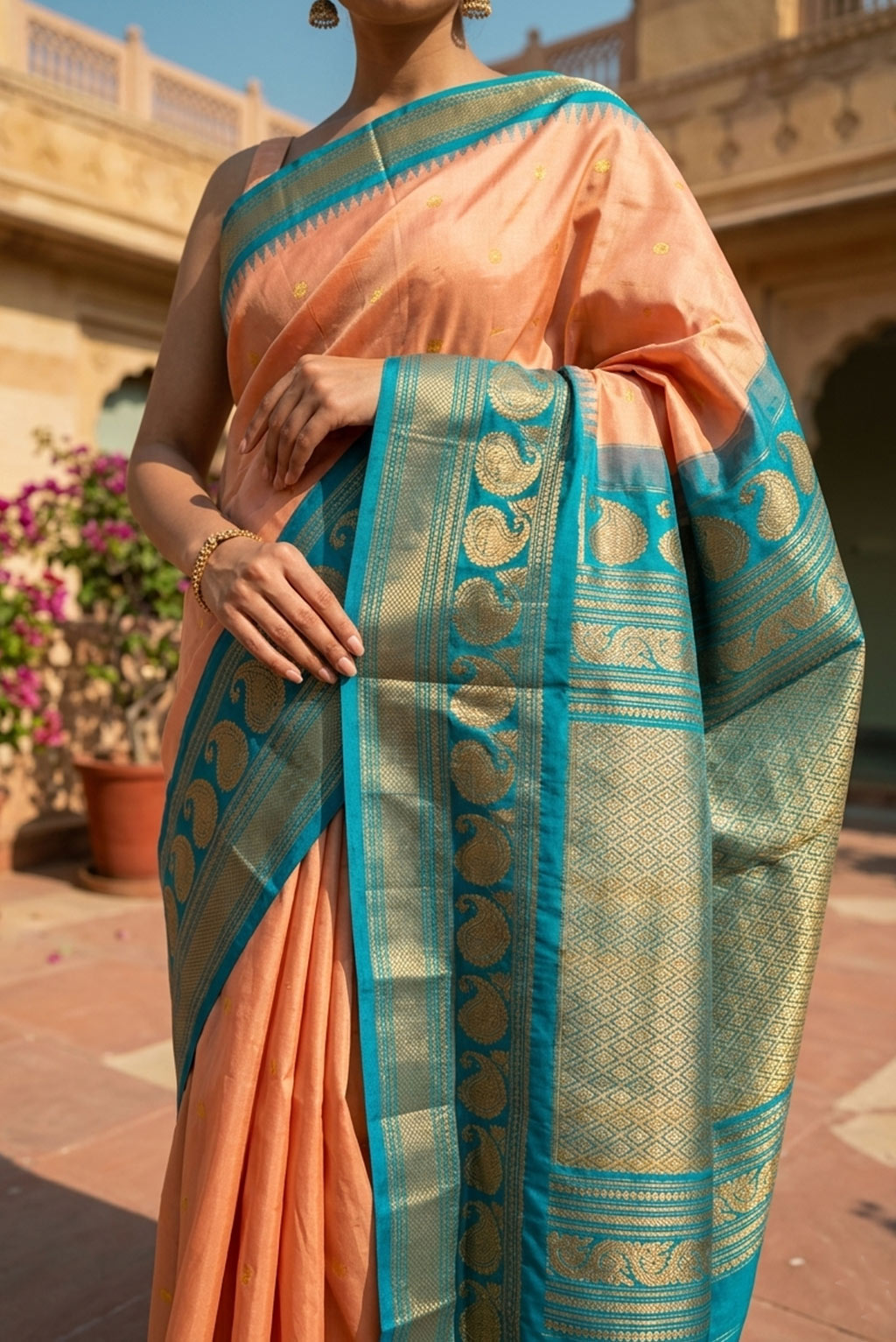 Gadwal peach shade butas with Aqua Green blue border handloom silk saree